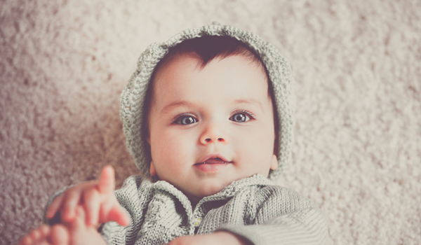 a little boy wearing a hat